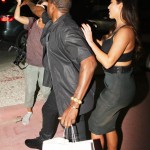 Kanye west trys to take female paparazzi's camera while on date with kim kardashian at the prime 112 in miami beach.