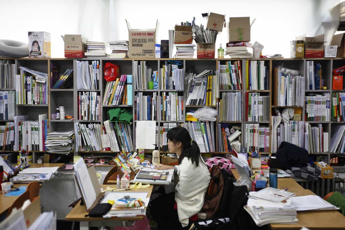 A student retaking the college entrance exams this year attends class at Deung Yong Moon Boarding School in Kwangju