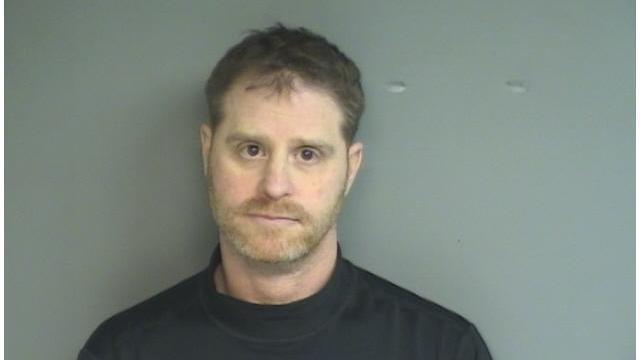 (Here's Alan in his mugshot . . . with his new haircut on display. It's not THAT bad, right?)
